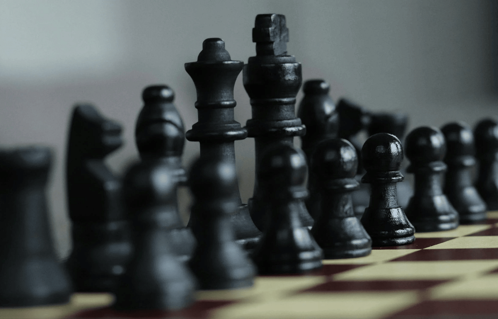 An image of chess pieces positioned on a chess board