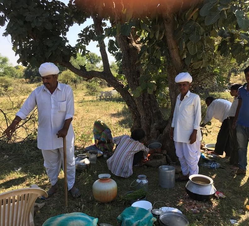 Locals preparing a meal in the field - Dev Shree, Deogarh