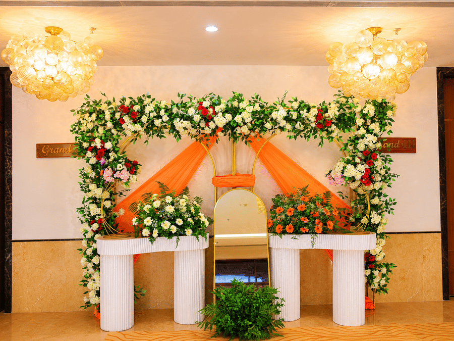 The decorative floral backdrop setup for wedding or event celebrations inside the banquet hall at Ambrosia Sarovar Portico, Haridwar.