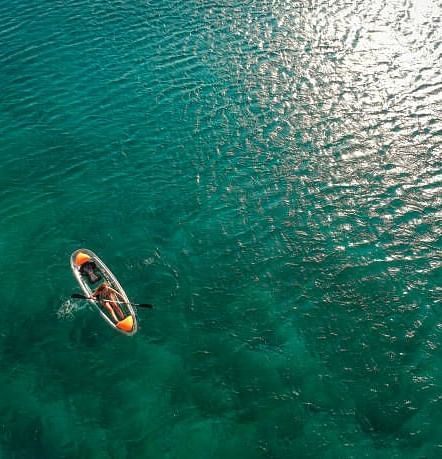 An image of a boat floating on  a river -  Alibu Resort Nha Thrang