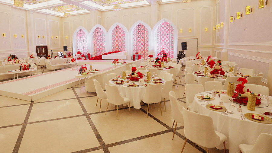 A corner view of an elegantly decorated banquet hall at La Maison, Doha, with round tables set for a formal event.