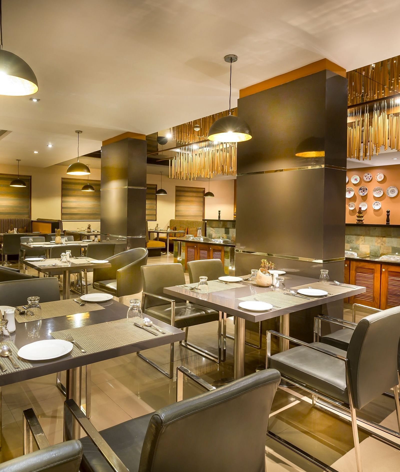  Modern restaurant interior with dark wood accents, leather chairs, and ambient lighting.
