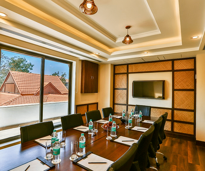 an image of a Meeting Room with a television and projector- Rhythm Lonavala