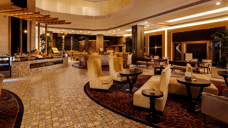 Lobby view with sofas at Grand Chennai By GRT Hotels.