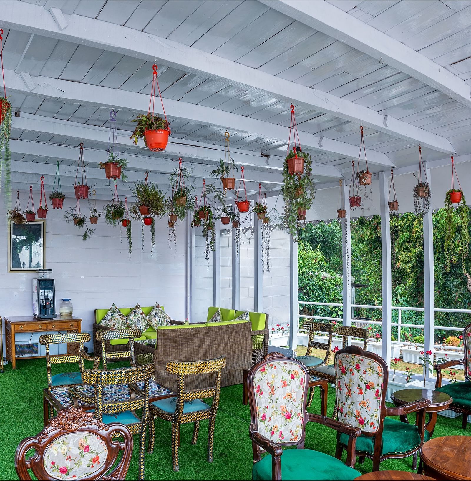 Open-air restaurant seating arrangement at Summit Barsana Resort & Spa, Kalimpong