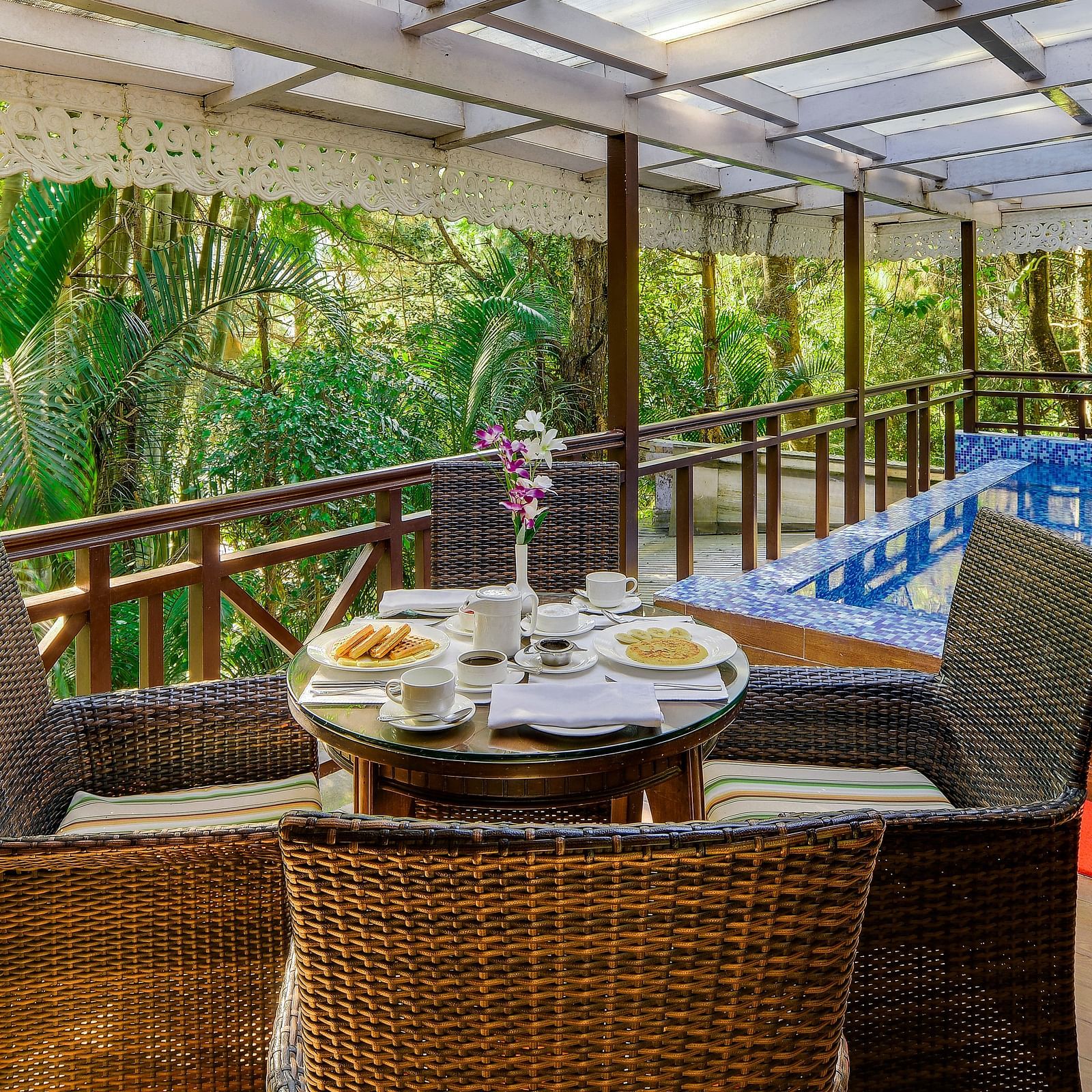 the outside dining seating space by a private pool attached with a room - Mayfair Spa Resort & Casino Gangtok 