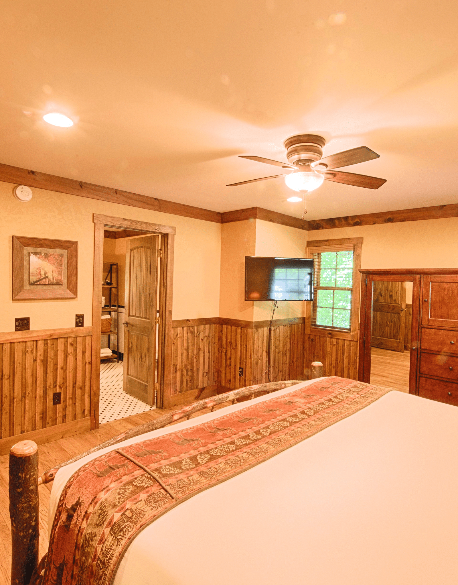 corner view of a bedroom with rustic wooden interiors overlooking a plush double bed - Historic Tapoco Lodge