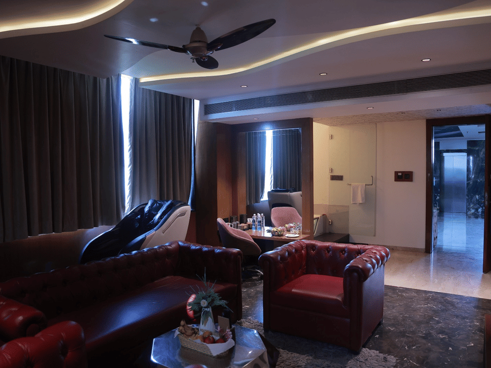 Skyline by Miraya, Sky Suite, Tufted leather sofas in the living area