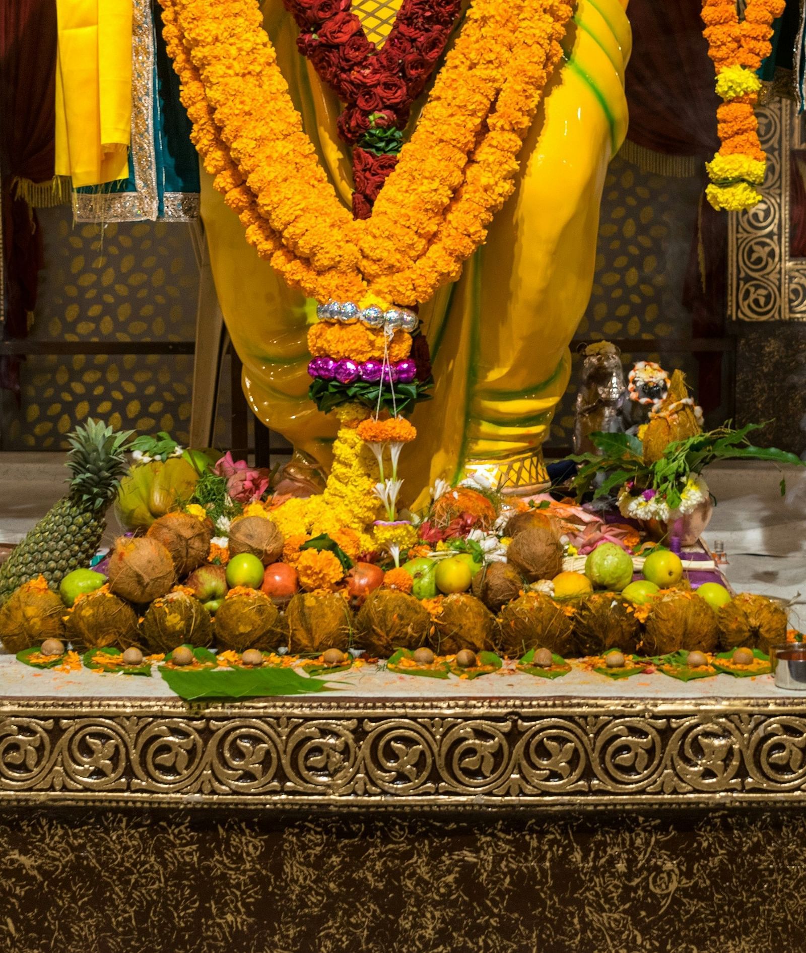 A view of pooja and ritual materials before hindu god's idol.