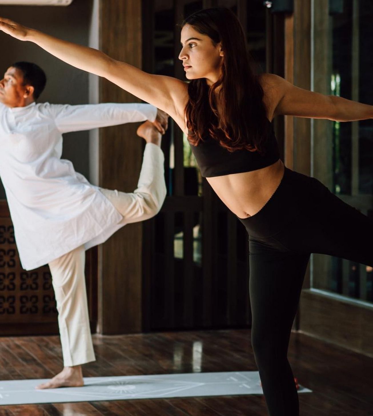 Two people practicing yoga in a morning light | Kavya Resort and Spa, Nagarkot