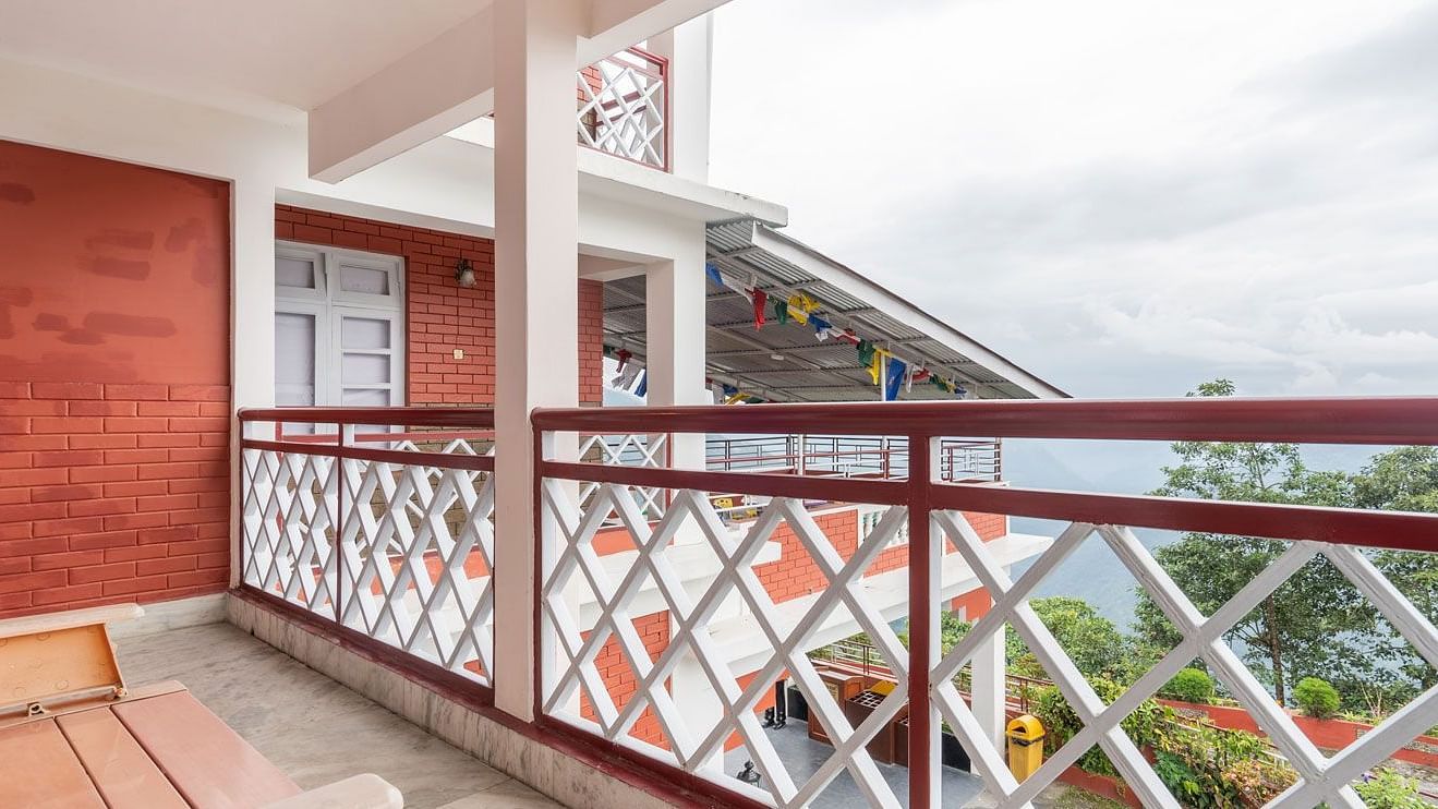 Image of a balcony with a bench at Summit Tashi Ghang Heritage Resort, Pelling