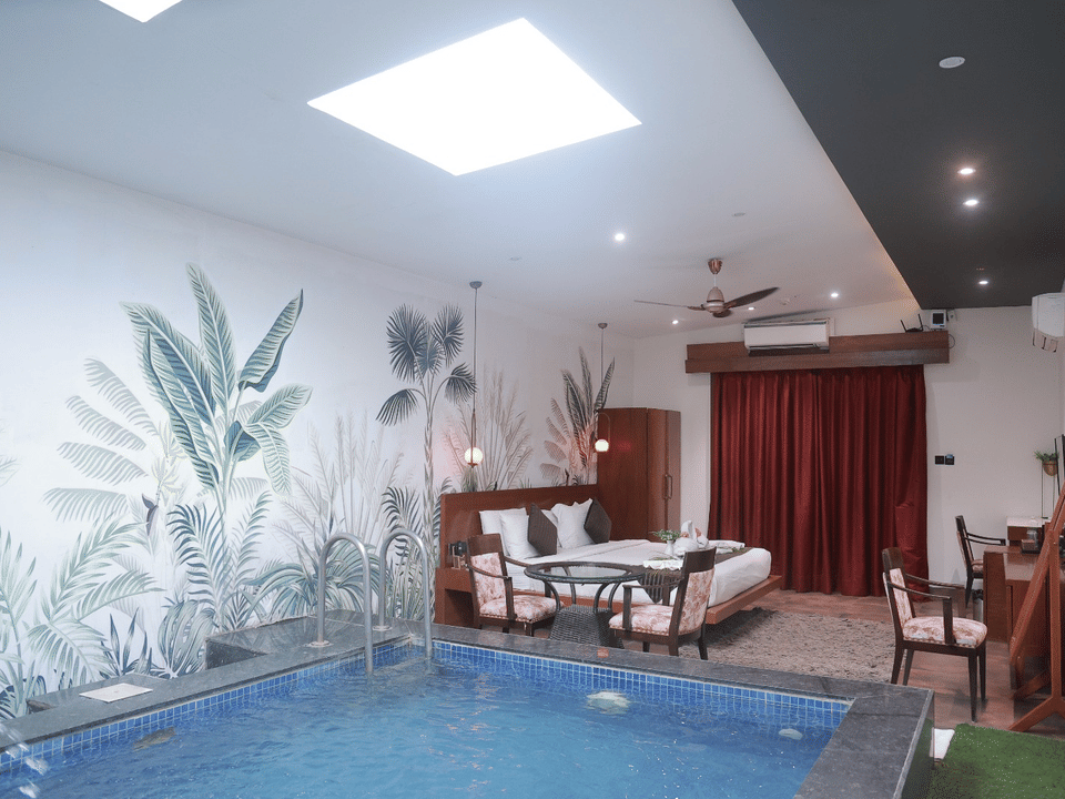 King Room, The in-room pool beneath the skylight, with the bed beyond