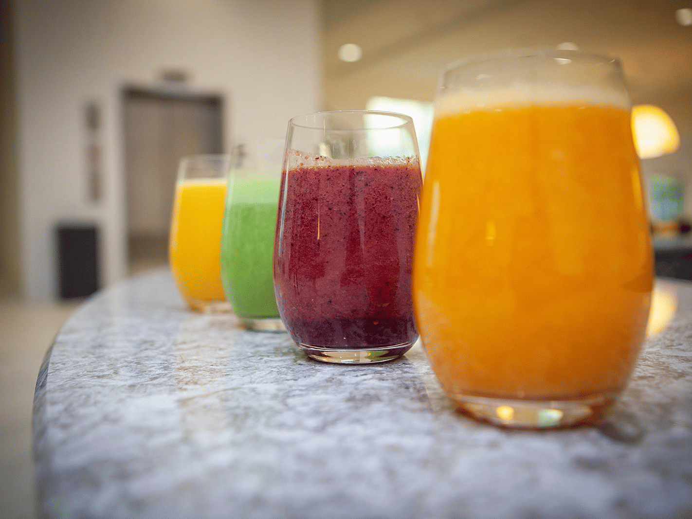 An assortment of freshly prepared fruit juices served at YO1 Longevity & Health Resorts, promoting health and vitality for guests.