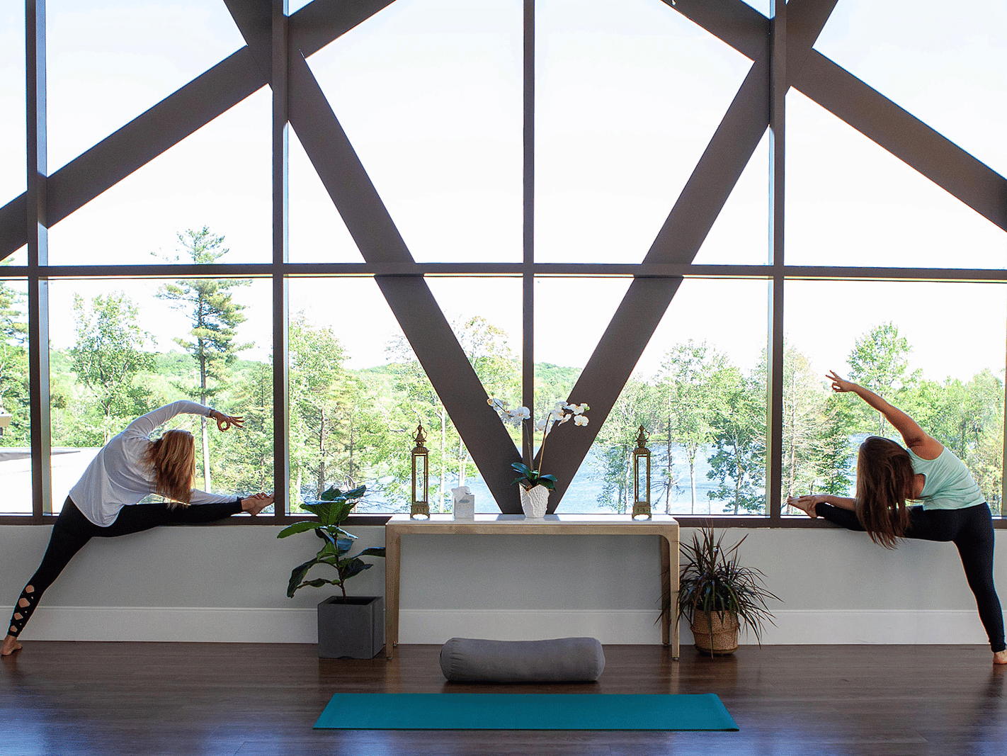 Guests engaging in yoga practice in a peaceful wellness area at YO1 Longevity & Health Resorts, focusing on health and mindfulness.