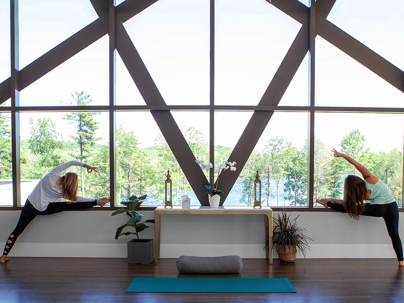 Guests engaging in yoga practice in a peaceful wellness area at YO1 Longevity & Health Resorts, focusing on health and mindfulness.