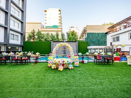 A wide view of an open event space beside a swimming pool Sun Park Hotel & Banquet, Chandigarh - Zirakpur