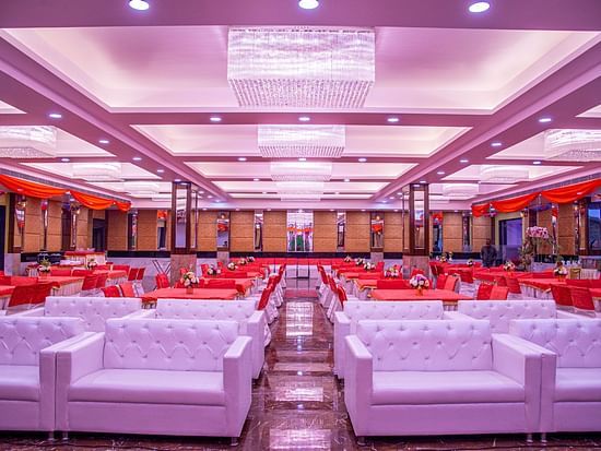 A front view of a banquet hall with sofas placed in a classroom seating style Sun Park Hotel & Banquet, Chandigarh - Zirakpur
