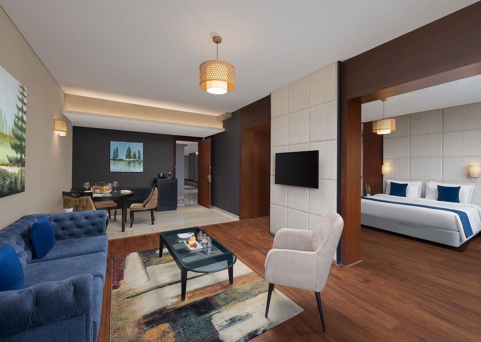 Living room area of Execuitve Suite at Essentia Luxury Hotel, Indore with sofa seating and coffee table set up.