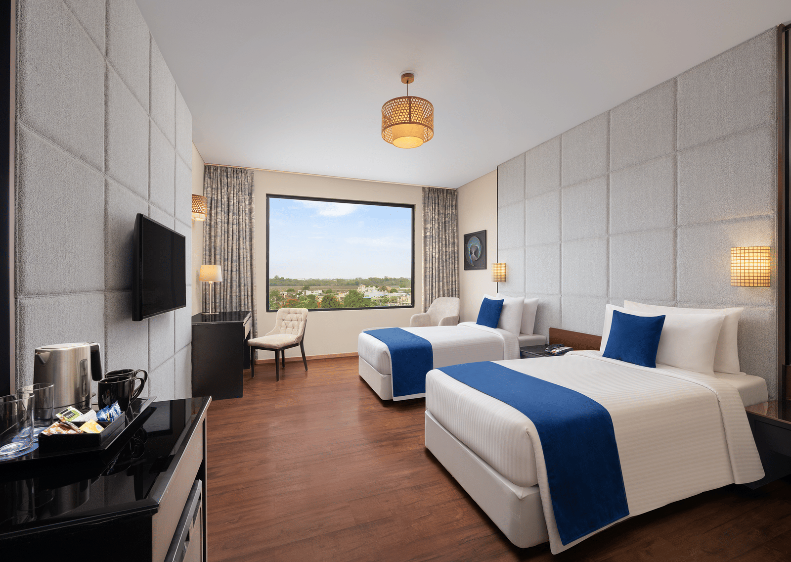 Premium Twin Pool View, modern decor, and elegant furnishings at Essentia Luxury Hotel, Indore.