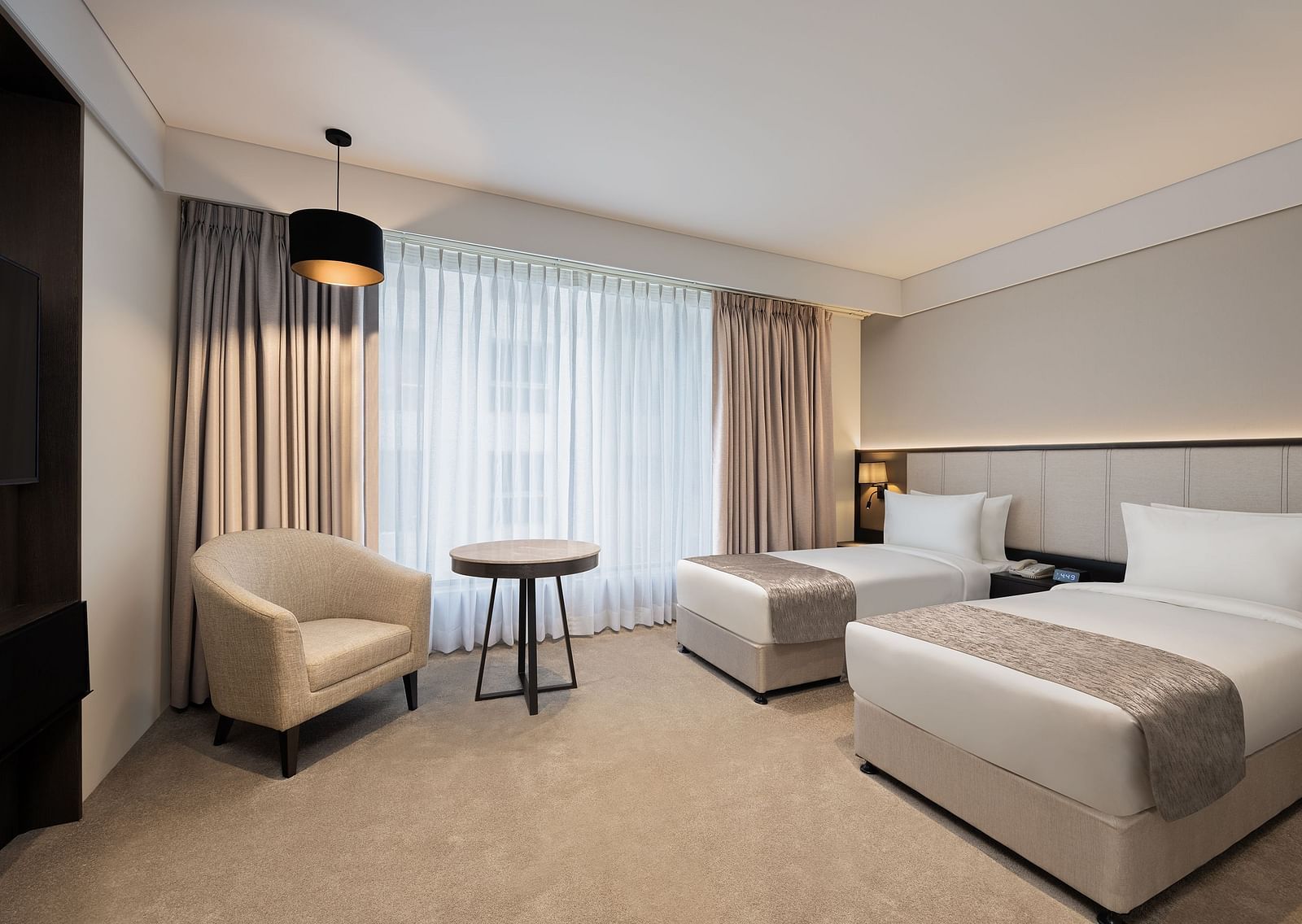 Deluxe Twin Room with twin beds at Essentia Premiere, Pune. 