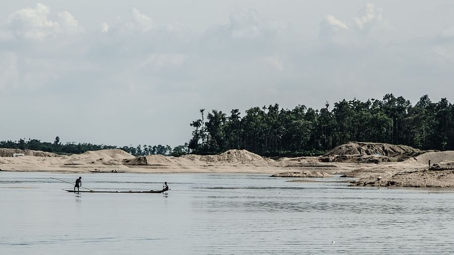 view of a river with a dawki passing by