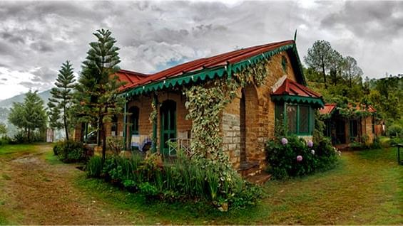 The facade view of the bungalow, showcasing infrastructure  and surrounding landscape - Ramgarh Bungalows, Nainital