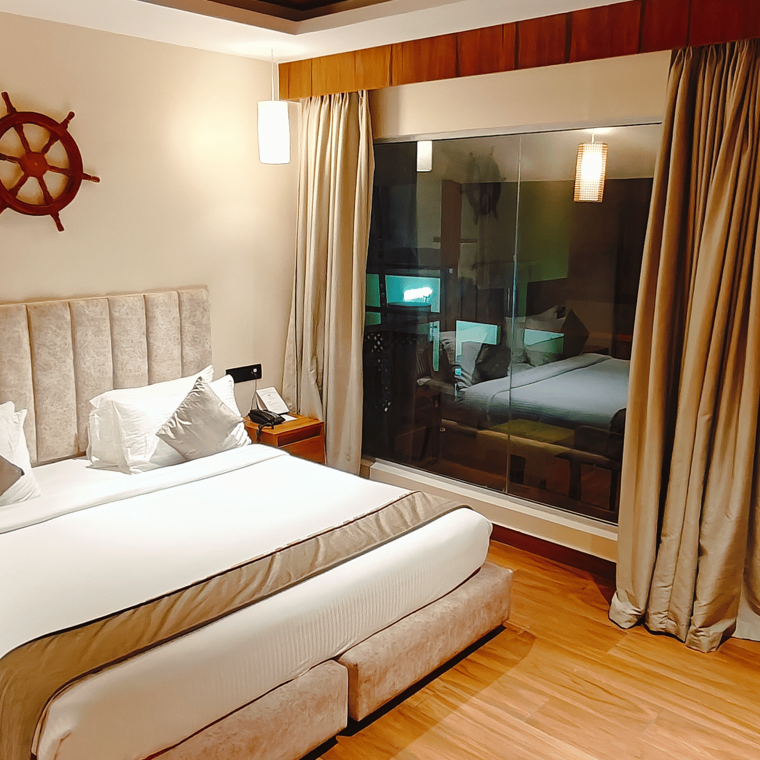  A well-furnished bedroom at Smith Balcony Villa with a double bed, soft lighting, and access to a balcony area