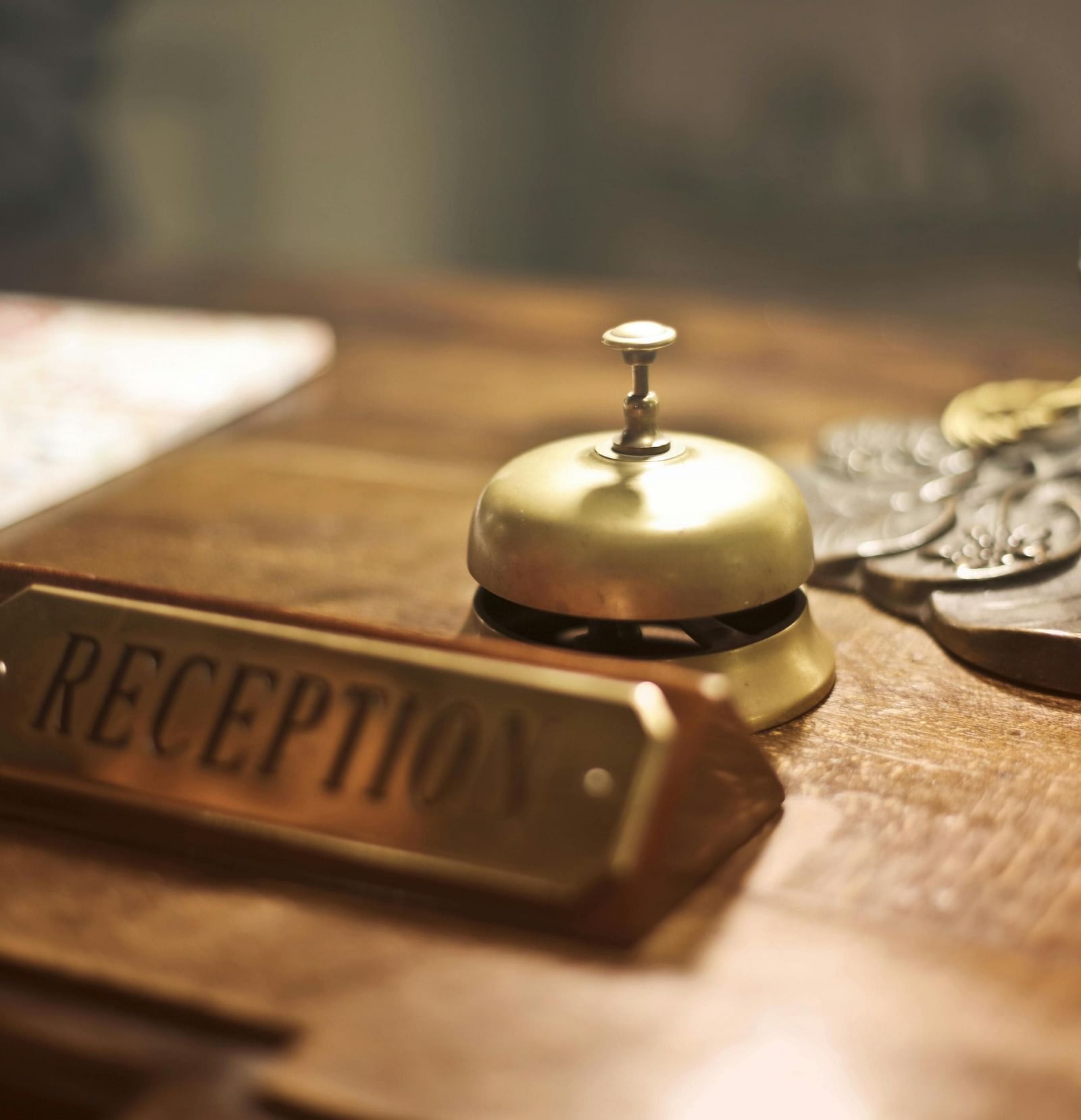 an image of concierge  bell placed on the reception desk