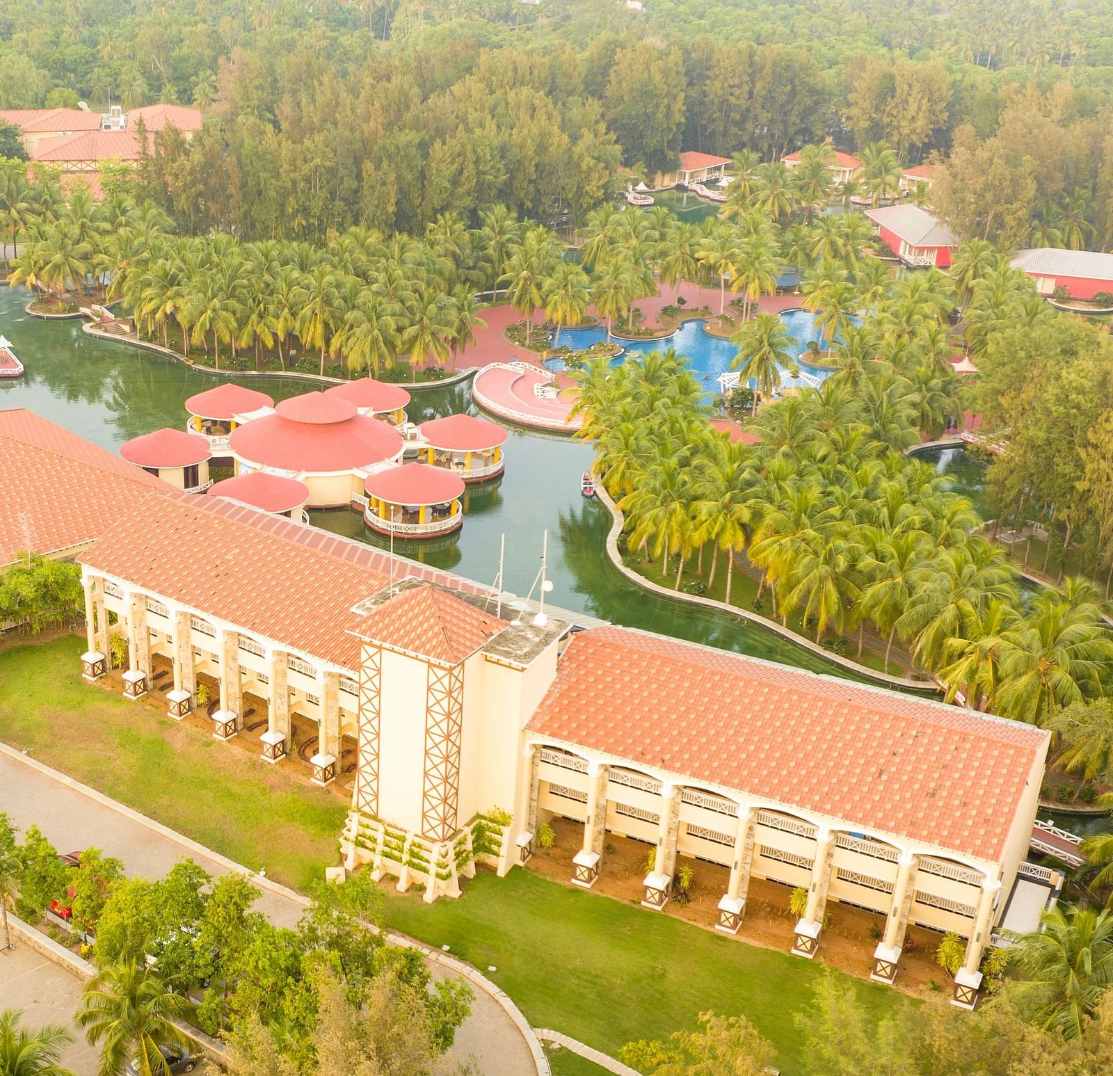 Aerial Resort View of Ocean Spray, Puducherry covered by trees and greenery