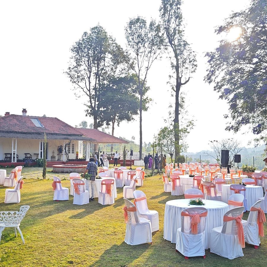 View of an outdoor wedding venue set against a backdrop of lush greenery and hills in Coonoor - Ibex Stays & Trails, Coonoor (Leewood).