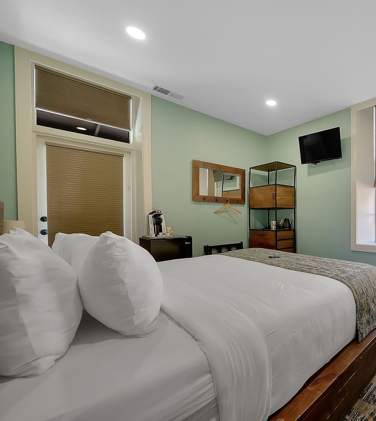 A view of a room at The Groveland Hotel with a double bed.