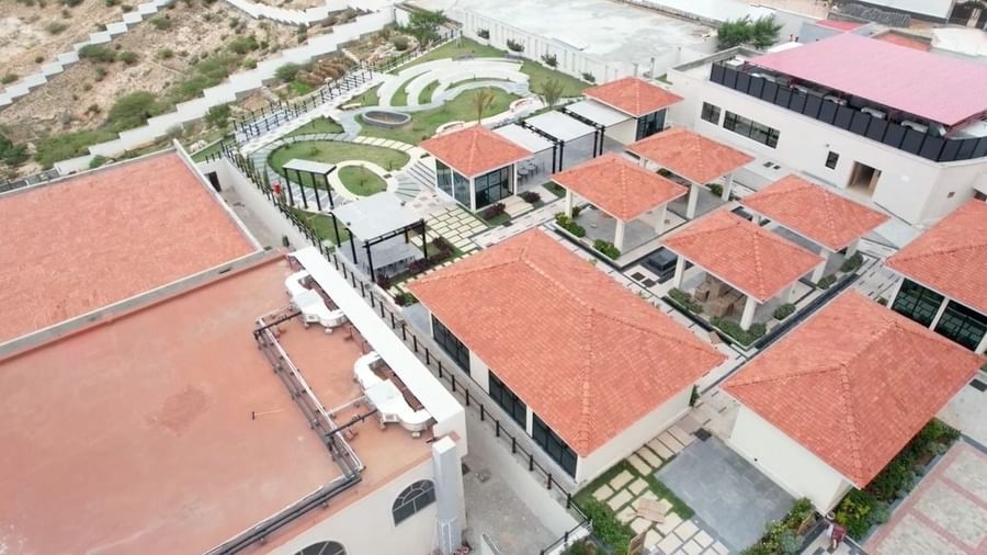 The aerial image of Mottola restaurant featuring tiled pathways and a landscaped lawn - Serene Sarovar Premiere Hargeisa