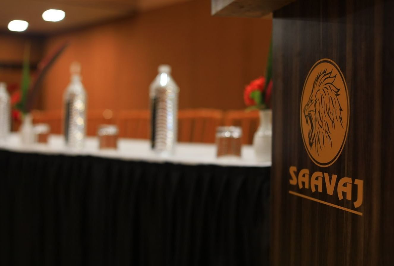 The Saavaj name and logo on a wooden desk.