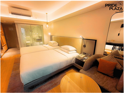 Well-Appointed Deluxe Twin Room at Pride Plaza Ahmedabad featuring Two Single Beds and En-suite Bathroom