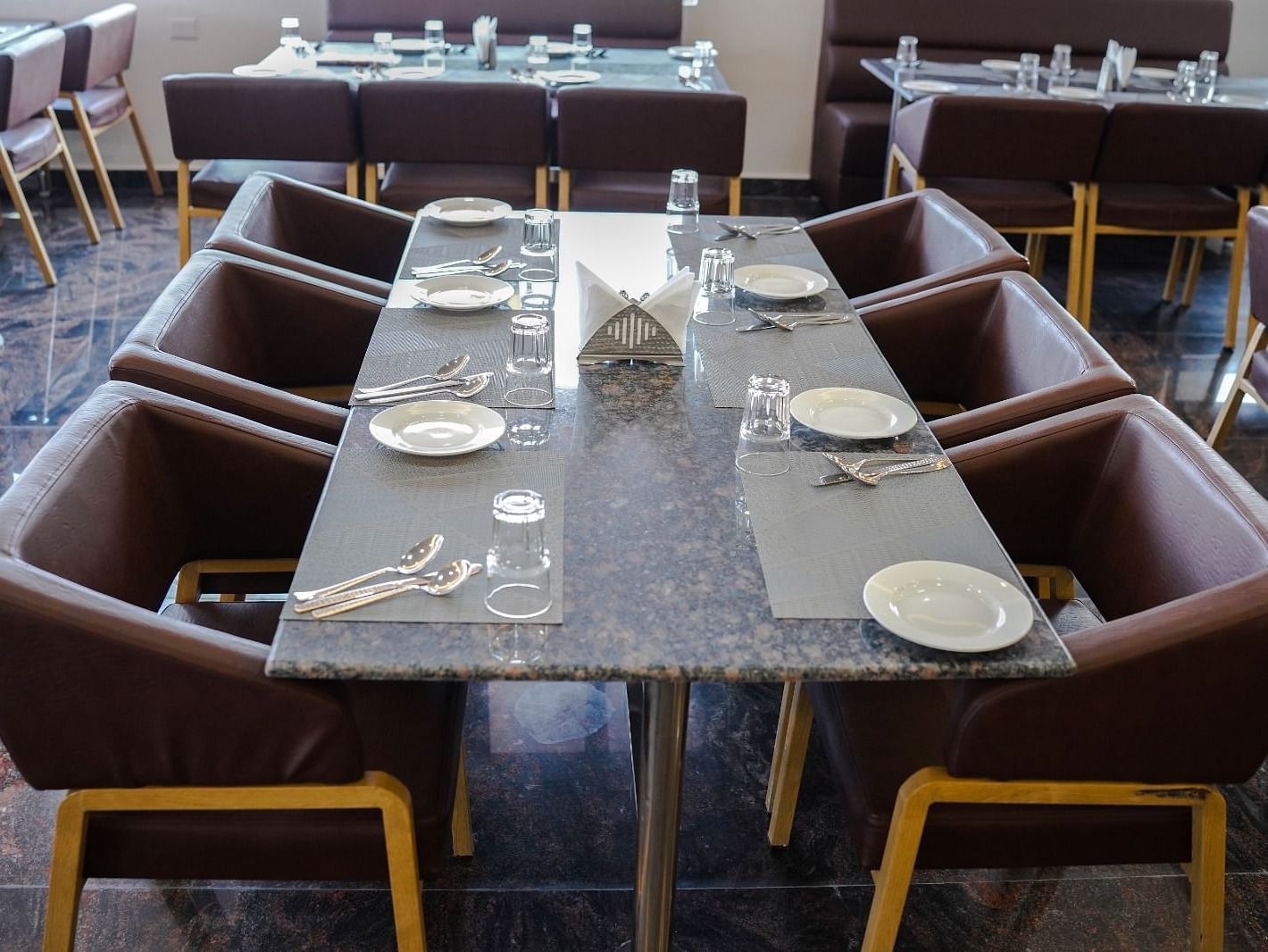 Dining arrangement in a restaurant at ANS M Square Hotel & Resort, Kalaburagi