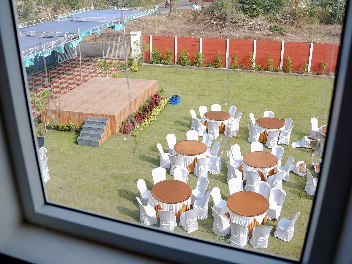 Seating  and stage arrangement in the garden area of ANS M Square Hotel & Resort, Kalaburagi