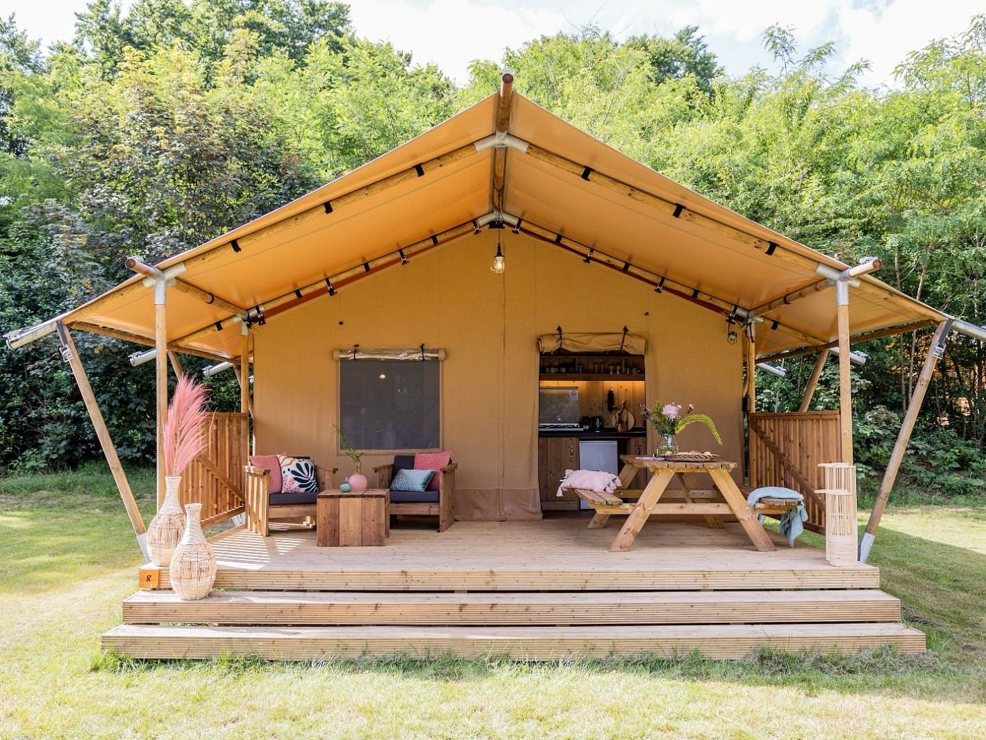 An overview of a wooden tent with a private sit out at WoCAL Retreat Ke Ga