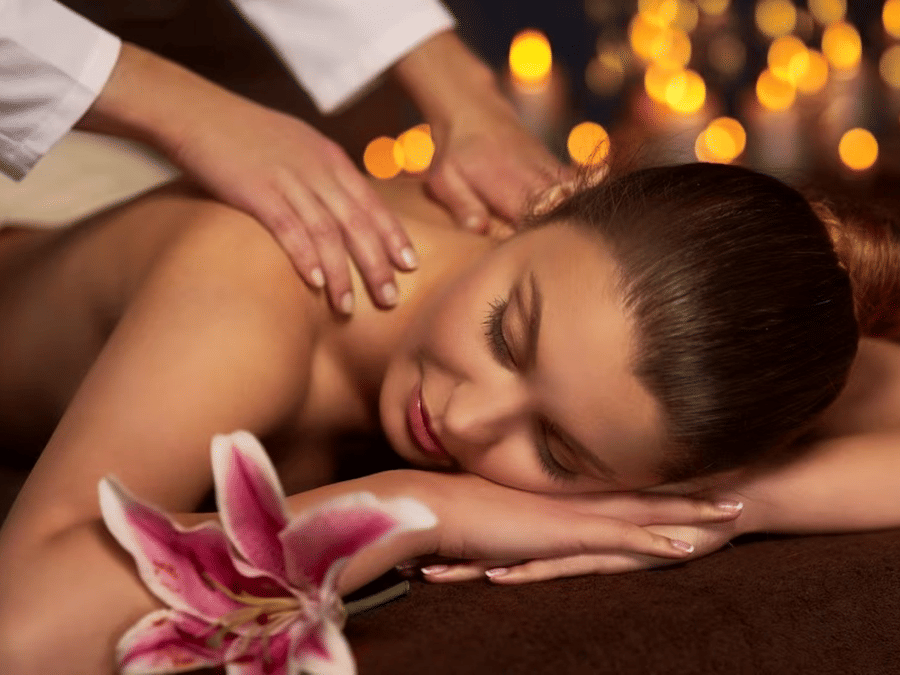 A woman reclining on the spa bed for a massage