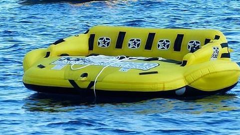 Air boat is floating on the water body.