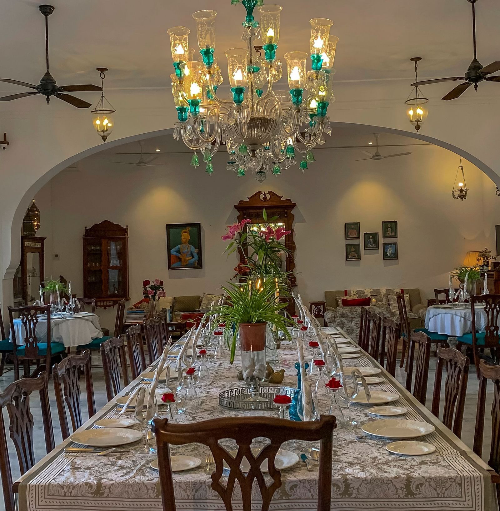 image featuring a long dinner table with neatly placed cutlery at Dev Shree, deogarh