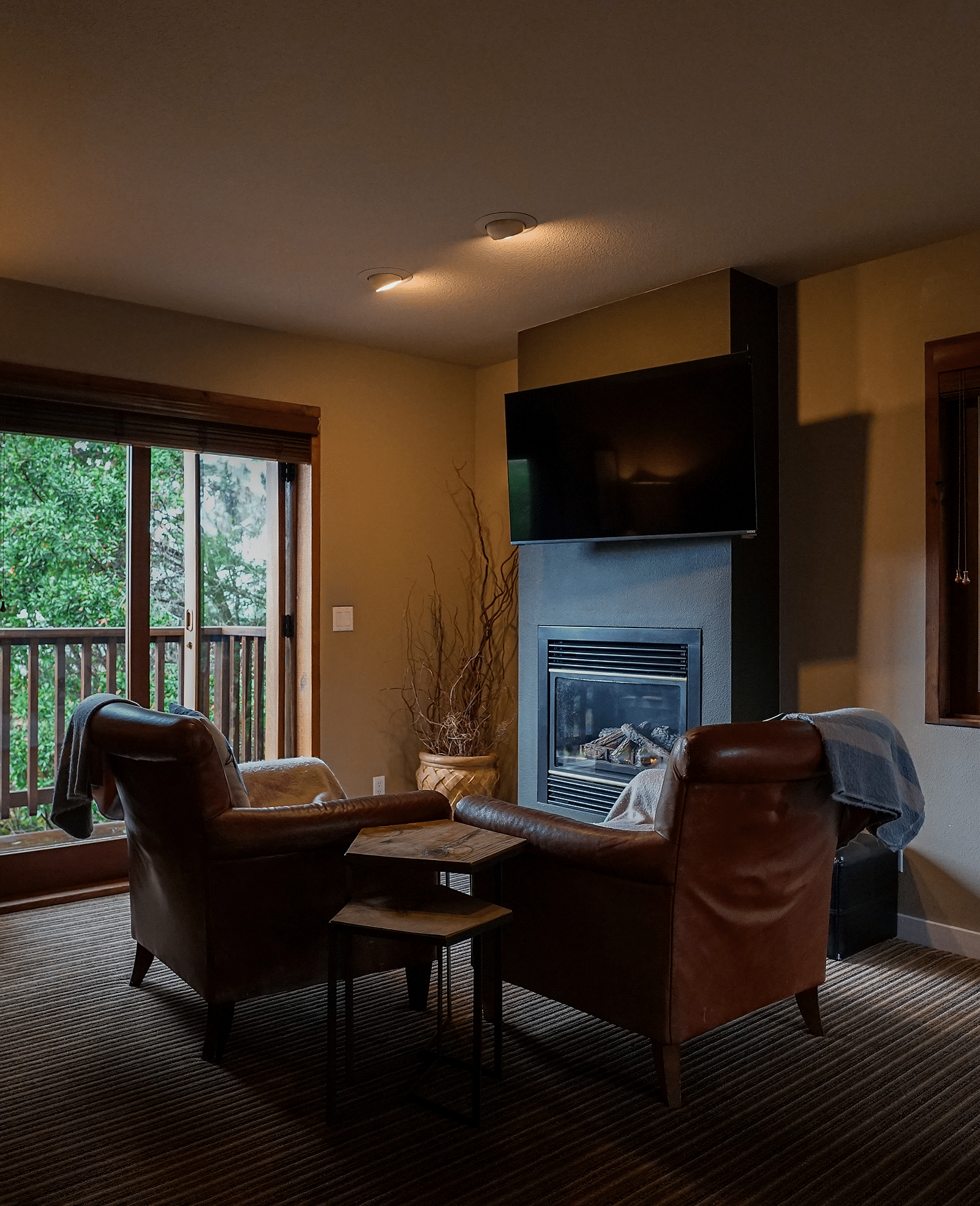Elegant hotel room with tasteful decorations, cozy couches, and soft lighting for a relaxing atmosphere - Brewery Gulch Inn & Spa