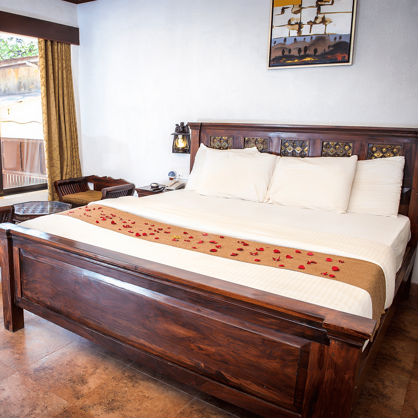 Adamo The Village - the balcony beside the king size bed offered at the Super Deluxe rooms in Matheran