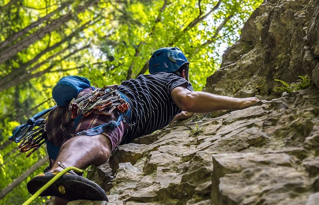 An image of two people climbing the rock