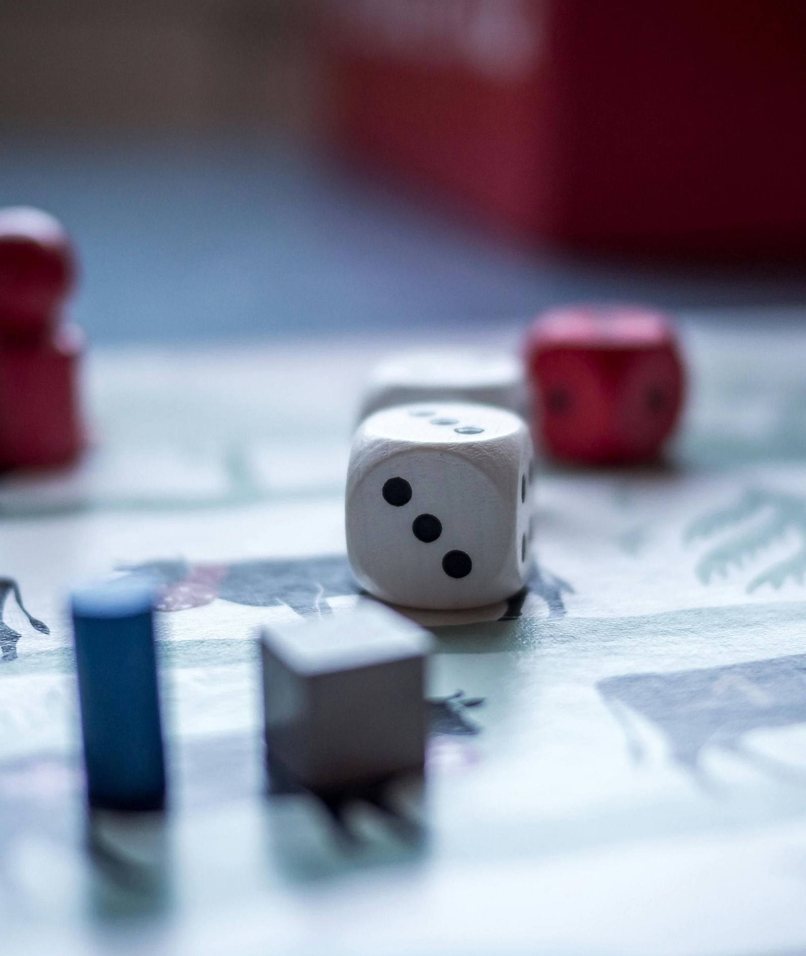 A close up shot of a board game set on a table during the day.