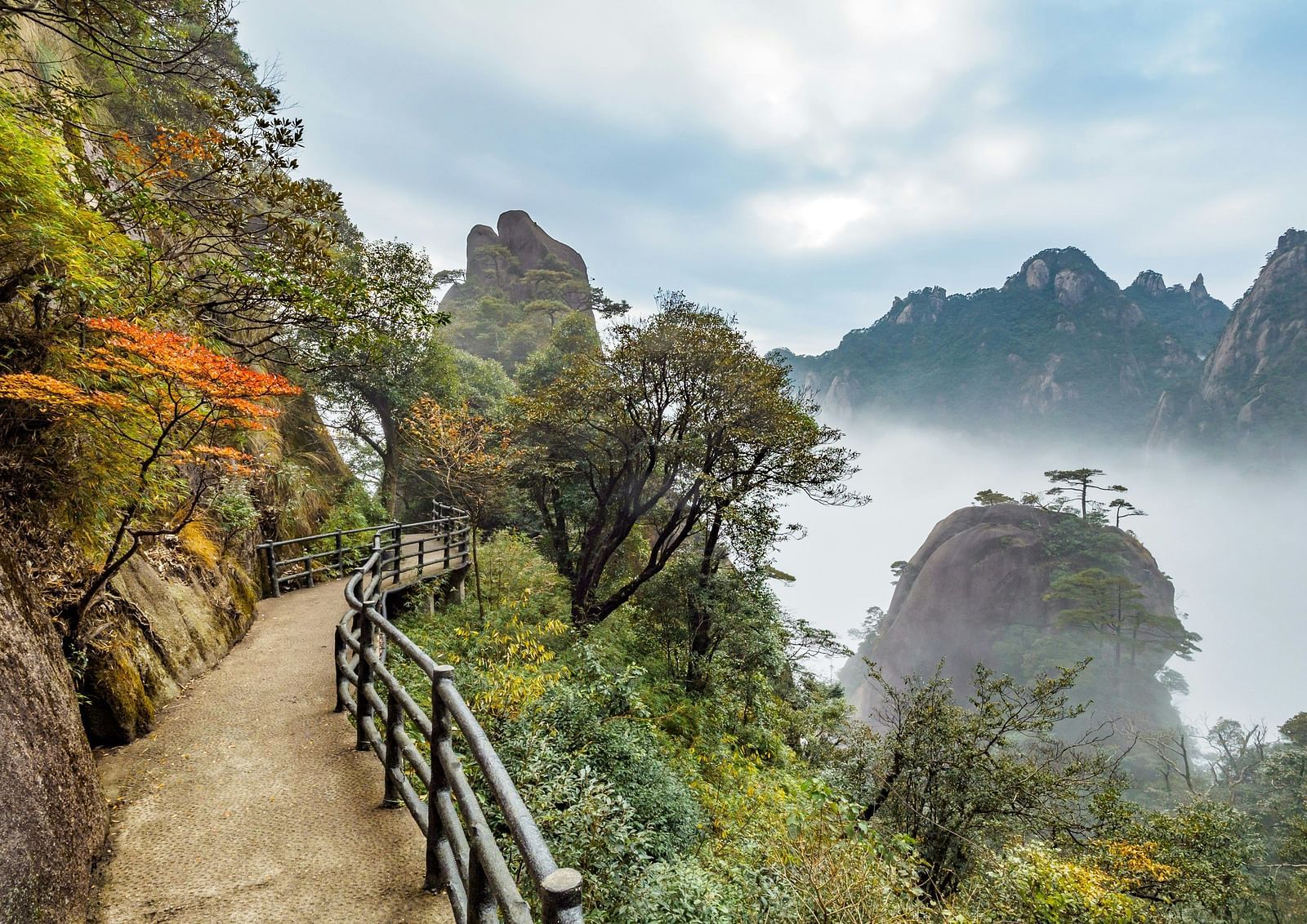 An image of a pathway by the side of mountains