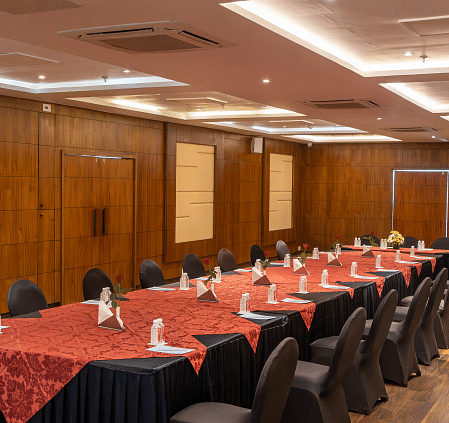 A conference room with a long table set for a meeting.- Bamboo Saa Resort & Spa, Udaipur.