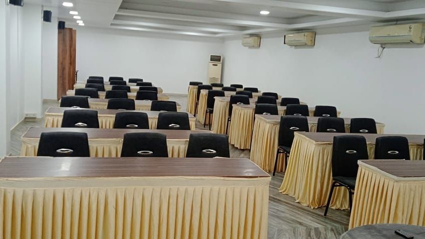 Tables and chairs arranged in classroom arrangement in the air-conditioned Emerald banquet hall of Mountview Resort.