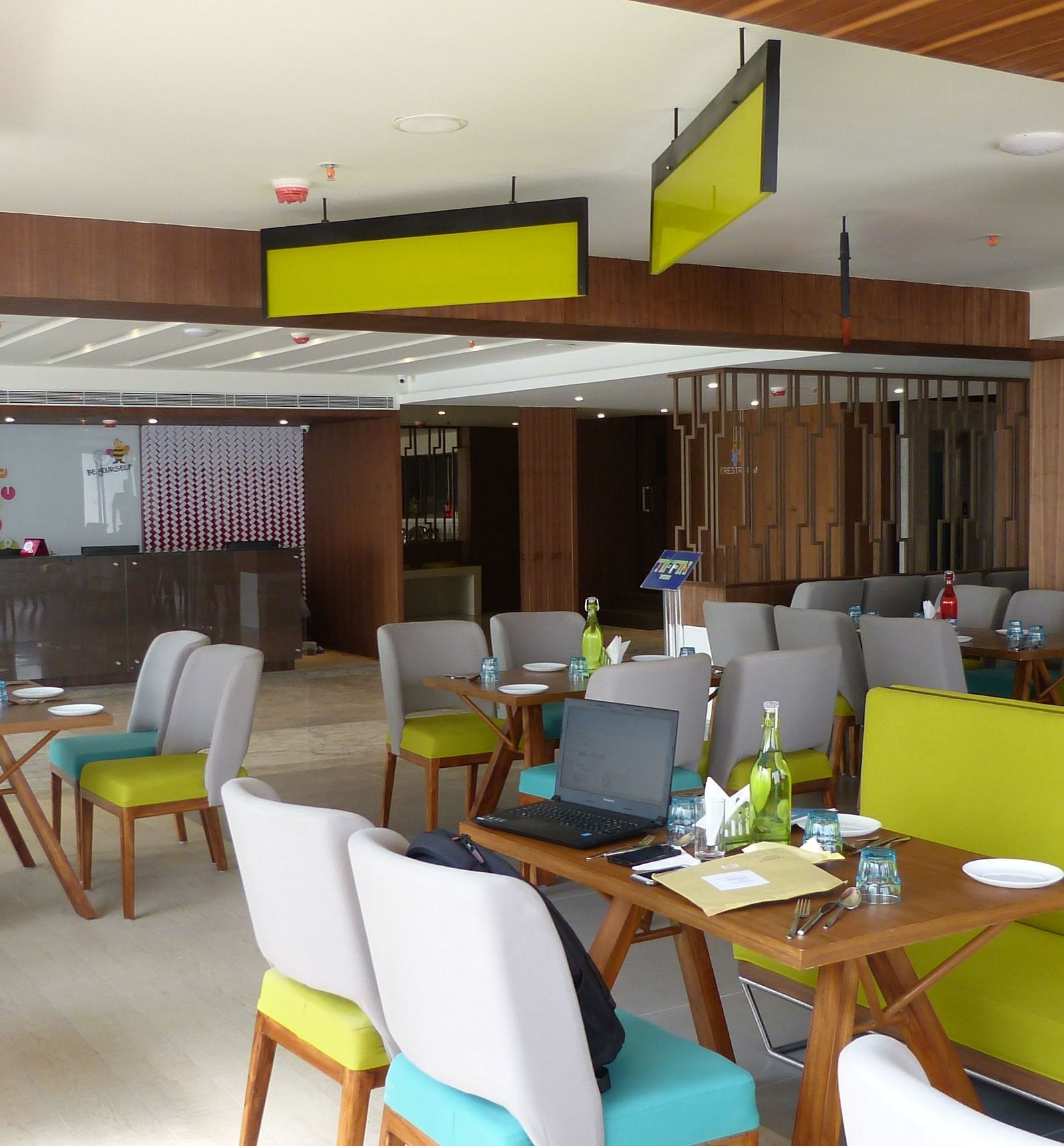 The dining area is set up with tables and chairs arranged neatly for the guests