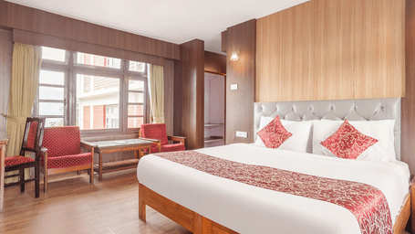 Image of a room with with double bed and sitting area at at Summit Tashi Ghang Heritage Resort, Pelling