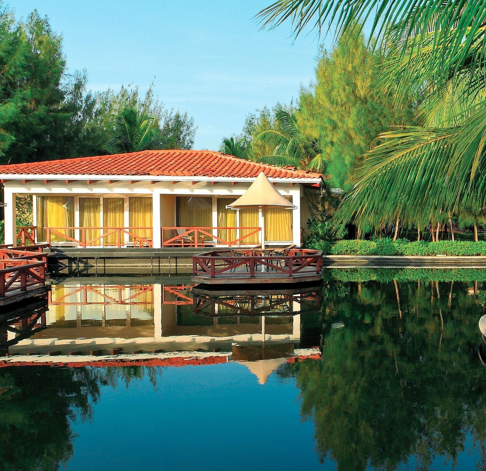 Bermuda Exterior with Deck in front of a lake at Ocean Spray, Pondicherry